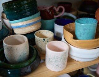 A selection of handmade ceramic cups and bowls.