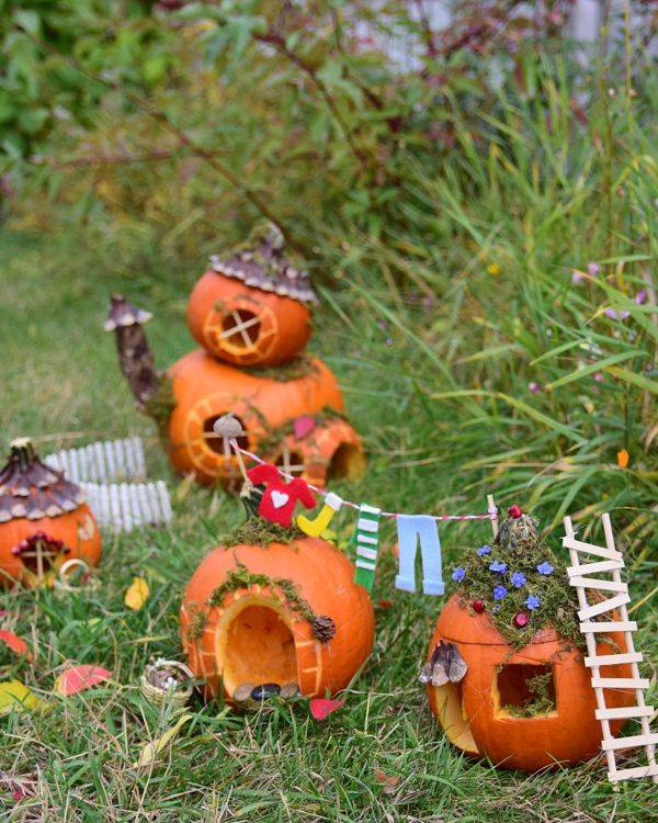 pumpkin fairy garden in grass outdoors