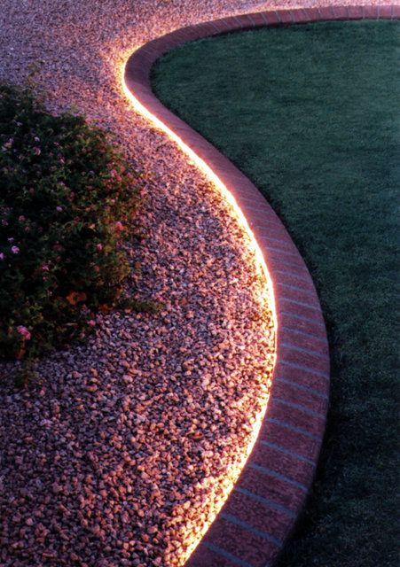 rope lighting down garden path stones grass
