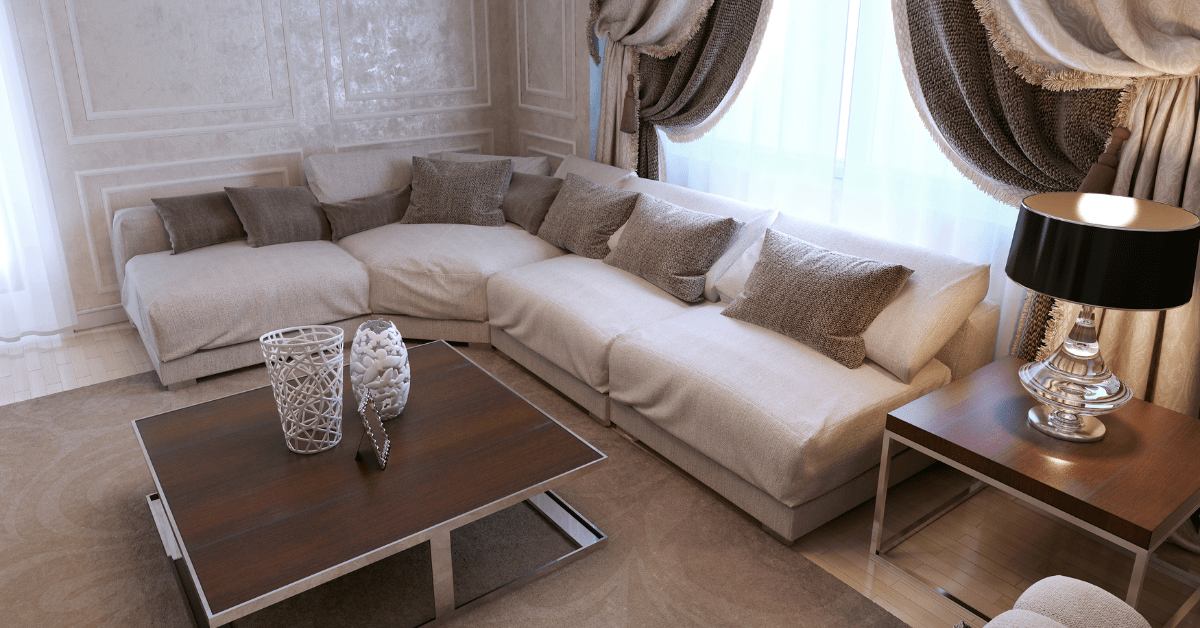 A living room in art deco style with covered couches.