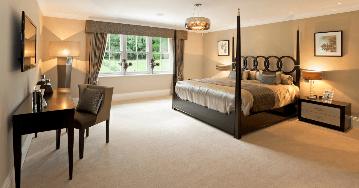 Large bedroom with a four poster bedroom.