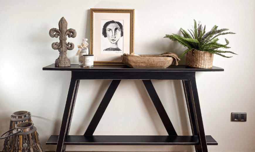 Entrance table covered in decor.